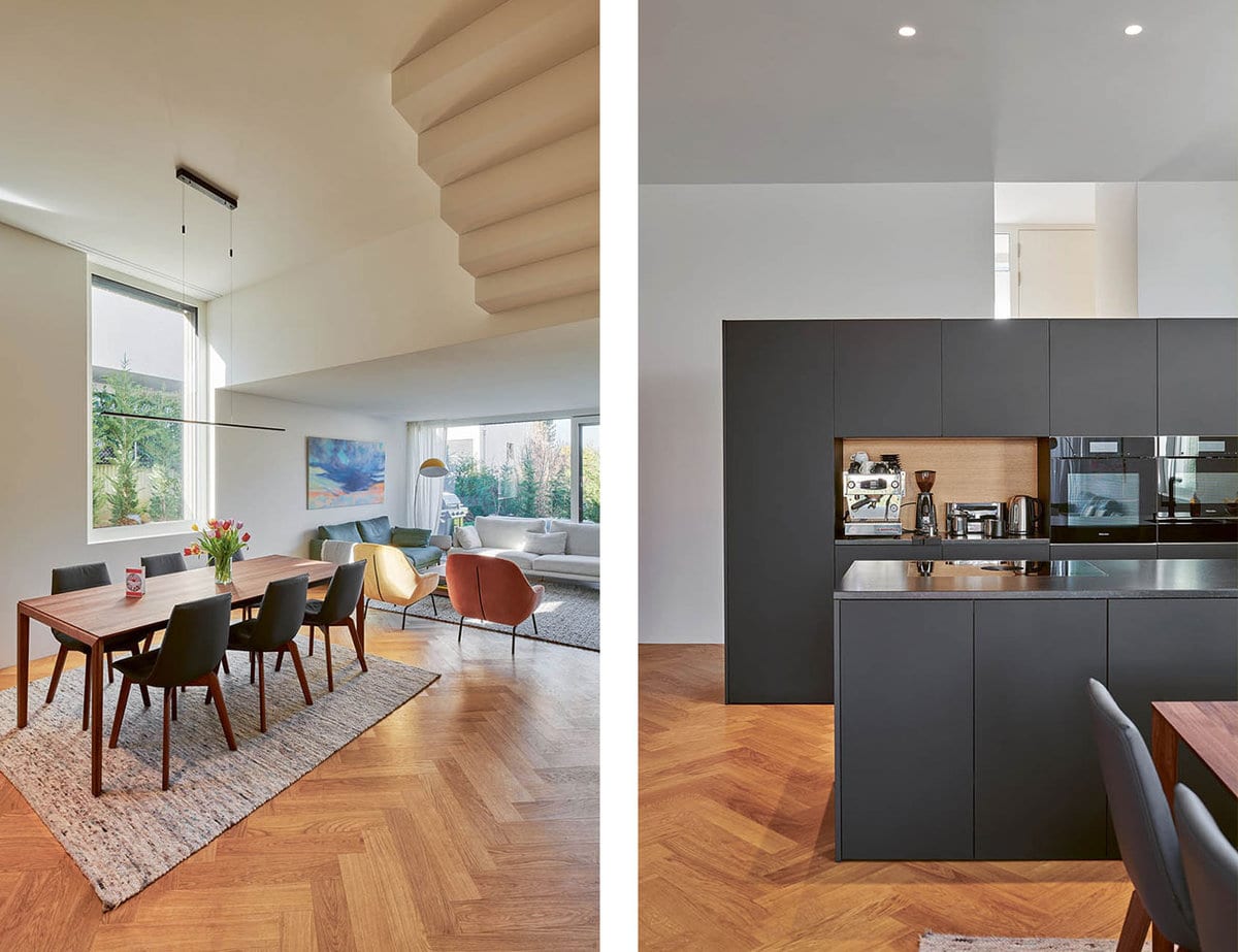 Bild eines Wohnzimmer und einer Küche. Beides ist modern gestaltet.